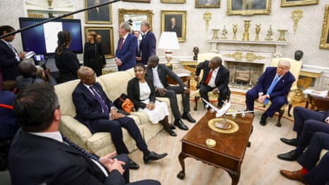 Donald Trump ambushes South Africa's president with video falsely claiming white genocide – video