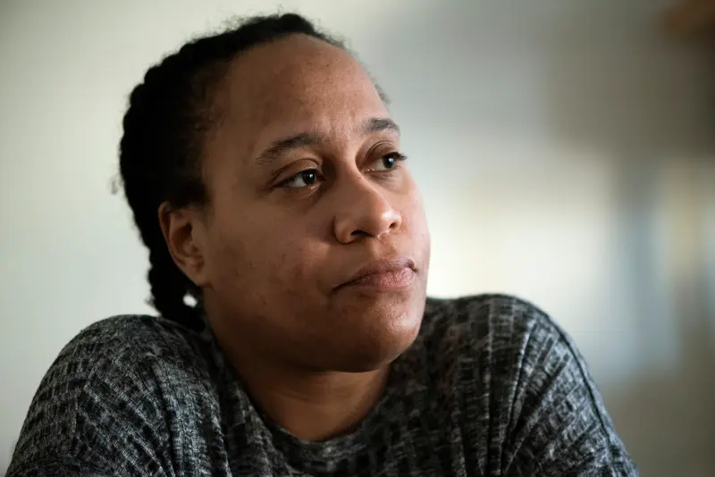 Stradford stares off in the distance, looking weary.