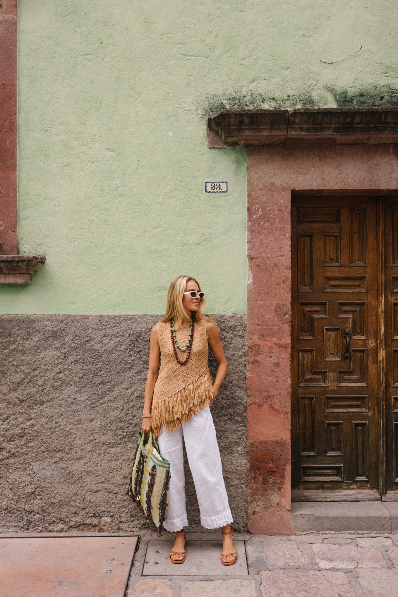Pantalon de lein blanc à la frange tissu blanc