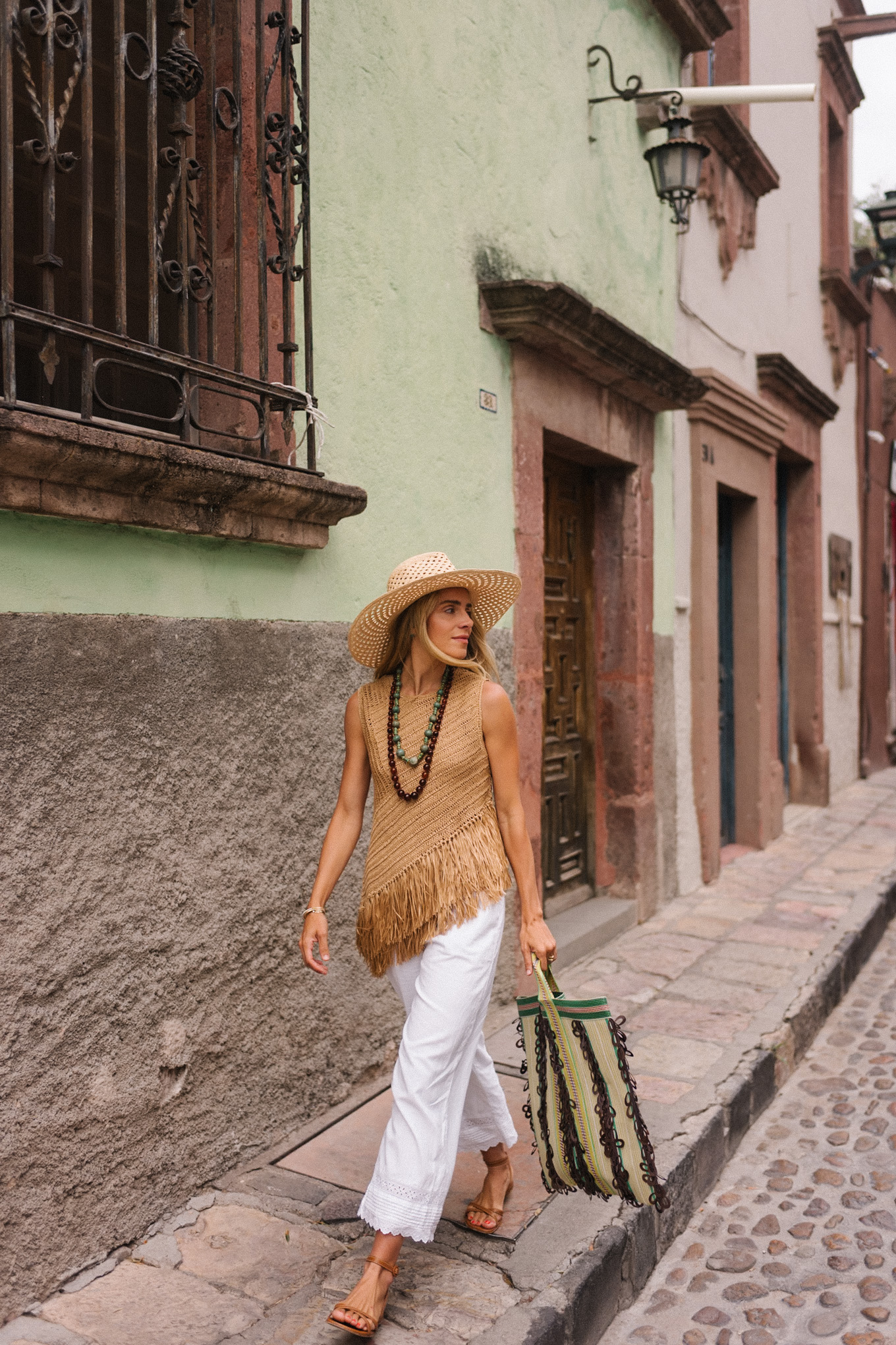 Pantalon de lein blanc à la frange tissu blanc