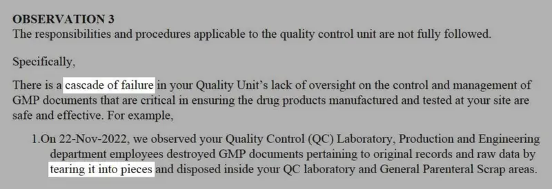 A grayscale image of an FDA report with the phrases “cascade of failure” and “tearing it into pieces” highlighted in white.