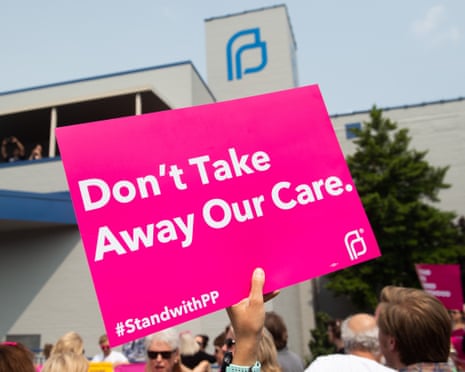 Pro-choice supporters and staff of Planned Parenthood hold a rally outside a clinic in St Louis, Missouri.