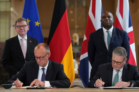 Keir Starmer (front right) and German Chancellor Friedrich Merz (front left), watched by Germany’s minister for foreign affairs Johann Wadephul and foreign secretary David Lammy, signing new UK-Germany treaty in London.