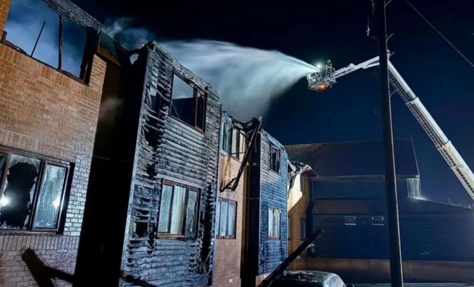 Firefighters extinguish a blaze at the Phoenix Hotel, on Epping Road, North Weald Bassett, 29 March 2025.