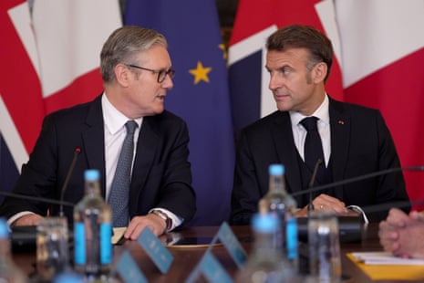 Keir Starmer and Emmanuel Macron attend a plenary at the UK-France summit in Downing Street in July 2025.