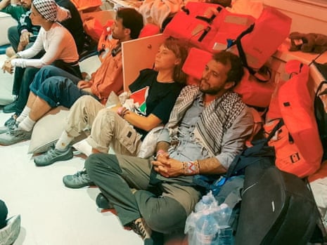 Swedish activist Greta Thunberg and Brazilian activist Thiago Avila sit in a vessel making their way to Israel, after Israel intercepted some of the vessels of the Global Sumud Flotilla aiming to reach Gaza and break Israel's naval blockade.