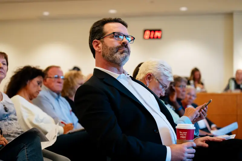 Dr. Remington Nevin, medical director of St. Clair County’s Department of Health, is seated in the front row of an August meeting of the St. Clair County Board of Commissioners.