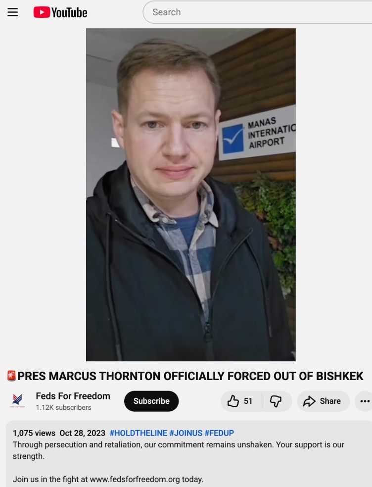 In a screenshot from YouTube, a man looks at the camera in a selfie video. Text reads, “Pres Marcus Thornton Officially Forced Out of Bishkek.” The video is on the account Feds for Freedom.