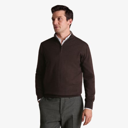 A model wears a Charles Tyrwhitt Pure Merino Quarter Zip Jumper in chocolate brown