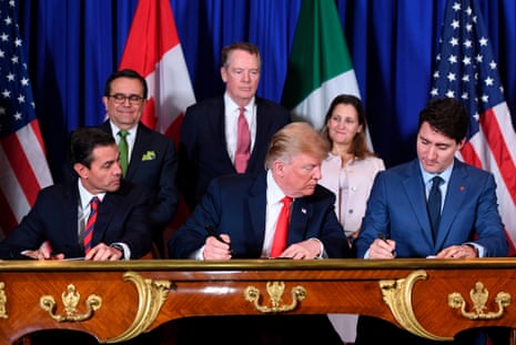 Donald Trump signs the US-Mexico-Canada Agreement (USMCA), with Mexico’s then president, Enrique Pena Nieto, and Canada’s then prime minister, Justin Trudeau, in November 2018.