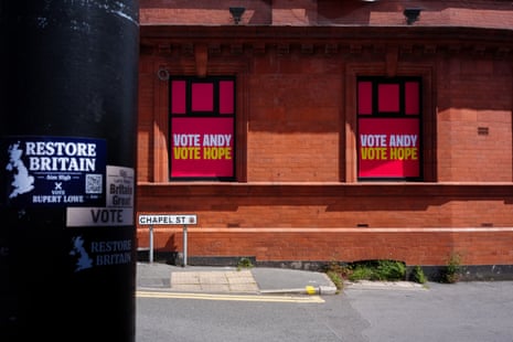 Restore Britain party stickers and Andy Burnham posters on display in Ashton-in-Makerfield today.
