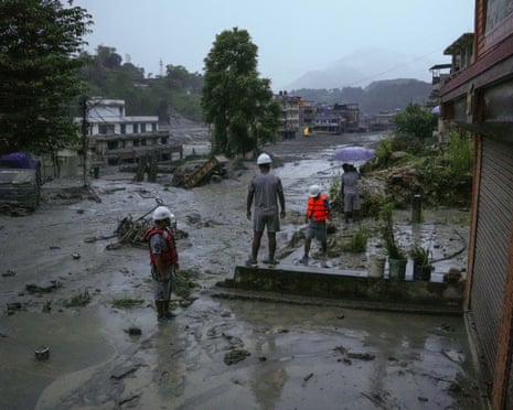 A road covered by flood waters in Nuwakot, Nepal, amid the unfolding disaster on Wednesday