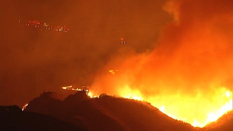 Night footage shows wildfires burning across California hills – video