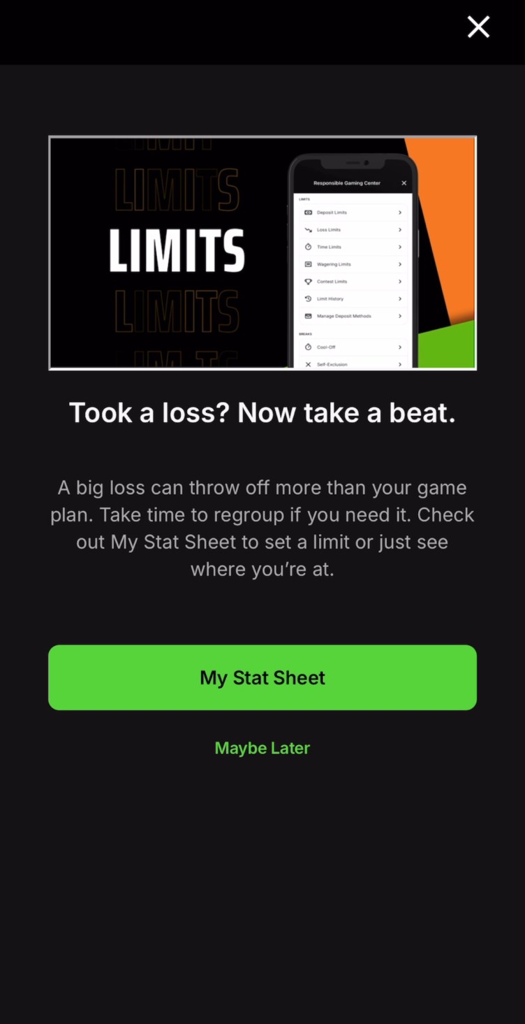 Alert reads, “Took a loss? Now take a beat. A big loss can throw off more than your game plan. Take time to regroup if you need it. Check out My Stat Sheet to set a limit or just see where you’re at.” A green button with text: “My Stat Sheet.” A black button below reads “Maybe Later.”