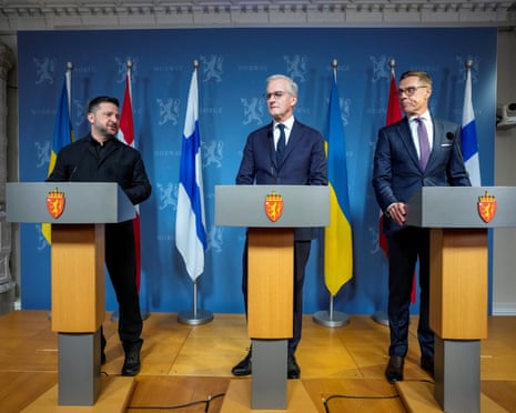 Zelenskyy, Støre and Stubb stand at podiums during a press conference in Oslo