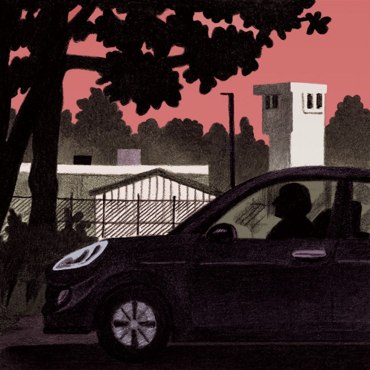An illustration depicts the dark silhouette of a person sitting inside a car parked outside a gated detention facility with a prominent watchtower in the background.